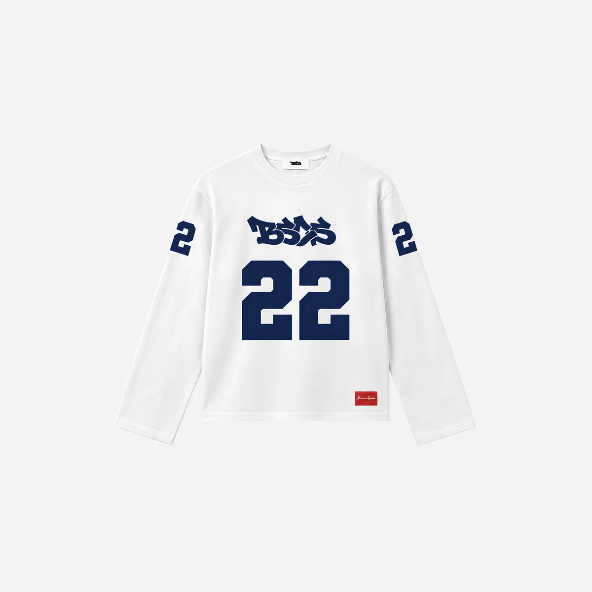BASICSS White 22 Longsleeve, featuring navy number 22 graphics, a graffiti-style chest logo and a red hem label, displayed against a light background.