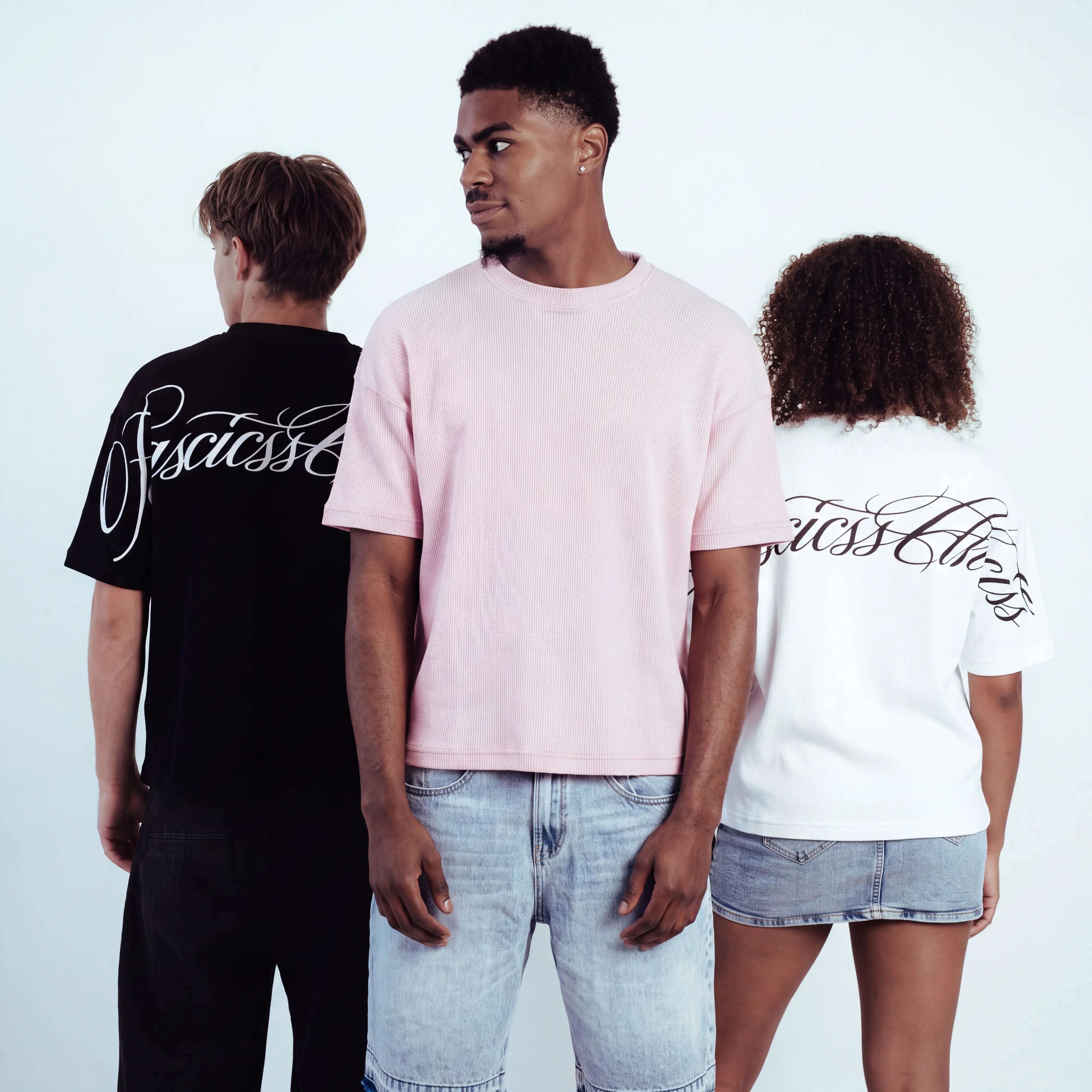 Three models wearing Waffle t-shirts with the brand name basicss printed in script across the back, shown from behind against a plain white studio background.